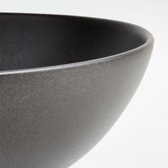 a black bowl sitting on top of a white table