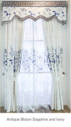 an antique bloom sapphire and ivory window curtain