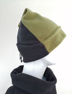 Moss green and black fleece hat with decorative linen cord and leather detail. (SALE) Size medium It is partially lined to retain stretch and comfort  Was £32.00 winter reduction £22.00 Windproof Beanie For Fall, Windproof Beanie For Outdoor, One Size Winter Hat For Outdoor, Adjustable Bonnet For Outdoor Fall Wear, Winter Outdoor Hat With Adjustable Fit, Casual Green Windproof Hat, Khaki Winter Hat One Size Fits Most, Brimmed Beanie For Outdoor Winter Use, Black Windproof Beanie For Fall