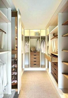 an empty walk in closet with lots of drawers