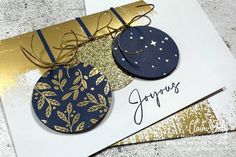 a close up of a greeting card with gold and blue decorations on top of it