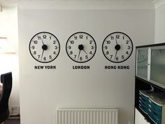 three clocks on the wall in an office with new york, london and hong kong