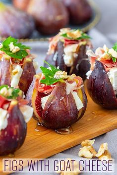 figs with goat cheese and walnuts on a cutting board