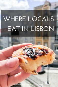 someone holding up a piece of food with the words where locals eat in lisbon