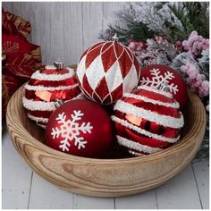 a bowl filled with red and white ornaments