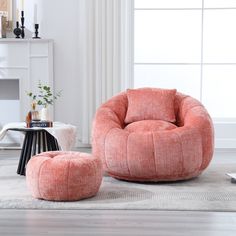 an orange chair and ottoman in a living room