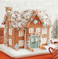 a gingerbread house decorated with icing and candy