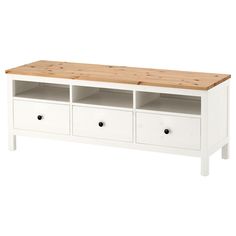 a white wooden bench with drawers on it's sides and an unfinished wood top