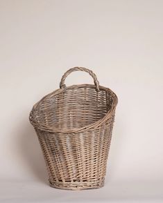 an empty wicker basket on a white background