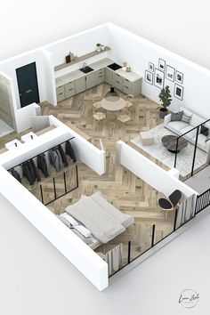 the floor plan of a modern apartment with wood floors and white walls, including an open concept living area