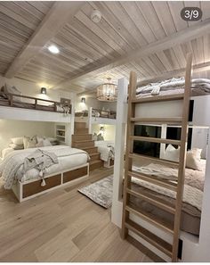 a bedroom with bunk beds and stairs in it