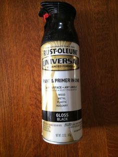 a can of rust - oleenn universal primer in one on a wooden surface