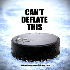 an ice hockey puck with the words can't deflate this