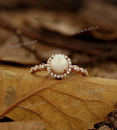 a close up of a ring on a leaf