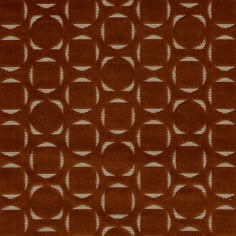 a brown rug with circles on it