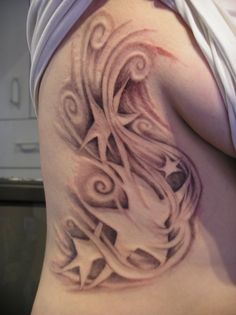 a woman's stomach with an artistic design on it