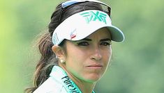 a female tennis player wearing a white visor