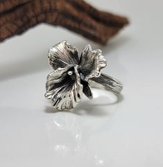 "The Cattleya Orchid is sometimes known as the \"Queen of Orchids\" it was also the very first orchid I carved in wax. I loved the beautiful flow of each petal. This ring is hand-sculpted and then cast in Sterling Silver. Size: 1\" x 1\"  (25mm x 25mm) Band Width: 3.8mm approximately  Material: 92.5 Sterling Silver  Finish: Polished with optional Antiqued/Oxidized finished as shown. Want this ring in 14k or 18k gold? Just message for pricing! Matching Necklace: https://www.etsy.com/listing/18726 Wax Carved Ring, Orchid Ring, Wax Carving Jewelry, Silver Metal Clay, Silver Casting, Wax Ring, Cattleya Orchid, Silver Flower Necklace, Wax Carving