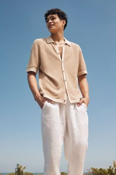 Beige Button-up Top With Placket, Summer Polo Collar Top With Buttons, Casual Collared Shirt With Placket, Classic Collared Tops With Cuffed Sleeves, Collared Tops With Button Cuffs, Beige Casual Collar Top For Summer, Beige Summer Top With Casual Collar, Summer Beige Top With Casual Collar, Casual Tops With Rolled Sleeves And Collared Neckline