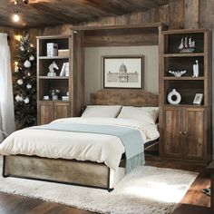 a bed sitting in a bedroom next to a wooden book shelf filled with books and decorations