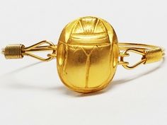 How A Dung-Loving Beetle Became One Of Jewelry’s Most Treasured Amulets+#refinery29 King Tut Tomb, Scarab Beetle, Art Deco Movement, Tutankhamun, Ufo Sighting, Ancient Egyptian Art, Jewelry Fashion Trends, European History, Ancient Aliens