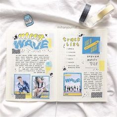 an open notebook with pictures and text on it, sitting on a sheet of white paper