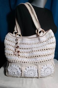 Crocheted shopping bag that has a small wallet that can be removed to help you leave your personal belongings so they won't get lost. It can be used for the beach as well as for shopping in stores. The size is not too big but also not too small. It is crocheted from cotton twine, very durable and strong, so that the bag can bear the weight. It can be used mostly in the summer months, but also throughout the year. The colors are bright and fit mostly with any everyday outfit. Size: 32 cm with 40 cm bag handles 59cm long with 3.5cm wide, the height from the top of the bag to the top of the bag handles is 33cm  wallet  15cm with 9cm material: 100% cotton twine wooden ornaments and wooden hoops The bag is unique and there is only one! Summer White Crochet Bag With Top Carry Handle, White Crochet Bag With Top Carry Handle For Summer, Lightweight Crochet Bag For Daily Use, Lightweight Rectangular Crochet Bag For Daily Use, Large White Bag With Top Carry Handle, Large Capacity White Crochet Bag For Shopping, White Shoulder Bag With Top Carry Handle For Vacation, White Crochet Tote Bag With Top Carry Handle, Beach Pouch Bag With Top Carry Handle