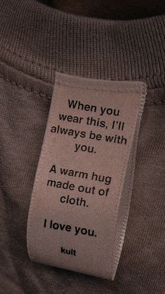 a person with a tag on their shirt that says, when you wear this i'll always be with you