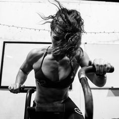 a black and white photo of a woman working out