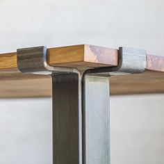 a metal and wood table with three different sections