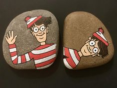 two rocks with cartoon characters painted on them