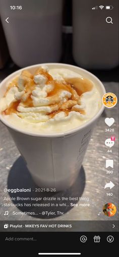 a cup filled with ice cream sitting on top of a table