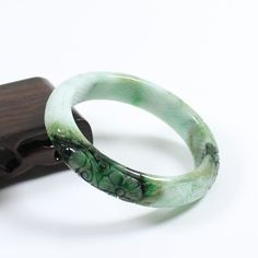 56mm Certified A Natural Green Carving Burma Jadeite Jade Bangle Bracelet 4873   Inside diameter * Width : 55.6 * 12.9 mm Weight : 53.83 g Density : 3.33 g/cm³ Payment:     We accept PayPal only, please confirm your address on eBay before you pay for your item, and we only ship to the address you left on eBay, hope you can understand.     If you had any question, please contact us via eBay message, we will respond you ASAP. Return Policy:     We offer a 14 days money-back guarantee.     If you decide to return it, please contact us and send it back within 30 days after receipt, in its original condition (including the packing materials) Thank you very much, hope you can have a nice shopping expericece. Payment Payment  WELCOME&FEEDBACK RATING: Hi my friend,we serve customer wholeheartedly Carved Jade Bangle As A Gift, Elegant Carved Green Bangle, Green Carved Bangle Bracelet, Green Carved Bangle Bracelets, Elegant Green Carved Bangle, Green Carved Bracelet As A Gift, Green Carved Bracelet For Gift, Green Carved Bracelets As Gift, Spiritual Green Bangle Bracelet