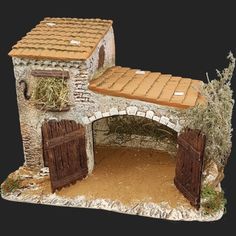 a model of a stone building with doors and windows