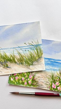 three watercolor paintings of grass and flowers by the beach