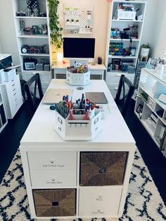 a desk with two drawers and several other items on top of it in a room