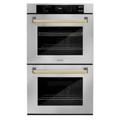 two built in ovens side by side with the door open and one is gold