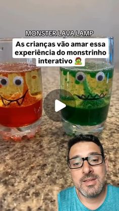 a man sitting in front of two glasses filled with liquid