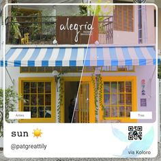 the front of a building with yellow doors and blue striped awnings on it