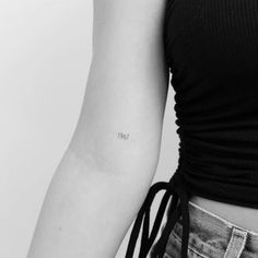 a woman with a small tattoo on her arm