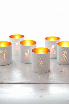 small candles are lined up on a table