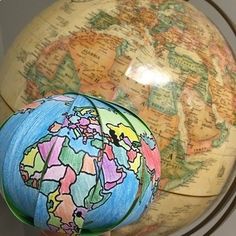 two decorative globes sitting on top of each other