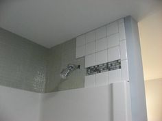 the shower is clean and ready for us to use in the bathtub or on the wall