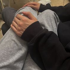 a person with their arm wrapped around another persons leg