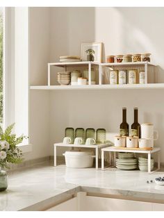 the shelves are filled with dishes and wine bottles