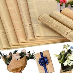 several different types of flowers in vases next to an open book with rolled up pages