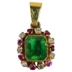 Fashioned from radiant 18K yellow gold, this exquisite pendant showcases a dazzling array of gemstones, including a 0.20 carat diamond, SI clarity, and G color, alongside a 0.30 carat Burma ruby and a striking 2.50 carat emerald. With a total carat weight of 3.00 carats, all sourced from natural earth mines, this pendant exudes unparalleled beauty and uniqueness, making it a truly remarkable piece of jewelry. Key Features: 18K yellow gold. 0.20 carat diamonds, SI clarity and G color. 0.30 carat Burma ruby. 2.50 carat emerald. TCW of all gemstones 3.00 carats. All gemstones are 100% natural earth mined. Beautiful pendant. Truly one of a kind. Ruby Pendant, Antique Pendant, Emerald Pendant, Jewelry Lookbook, Pearl Pendant Necklace, Natural Earth, Pearl Pendant, Vintage Necklace, Pendant Necklaces