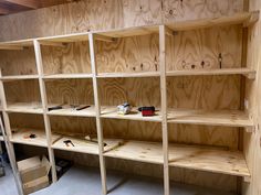 the shelves are made from plywood and have tools on them