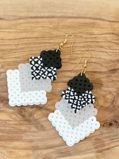 the black and white earrings are made out of plastic