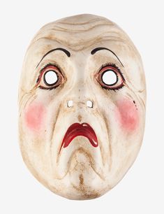 an old mask with red eyes and mouth is shown in the image on a white background